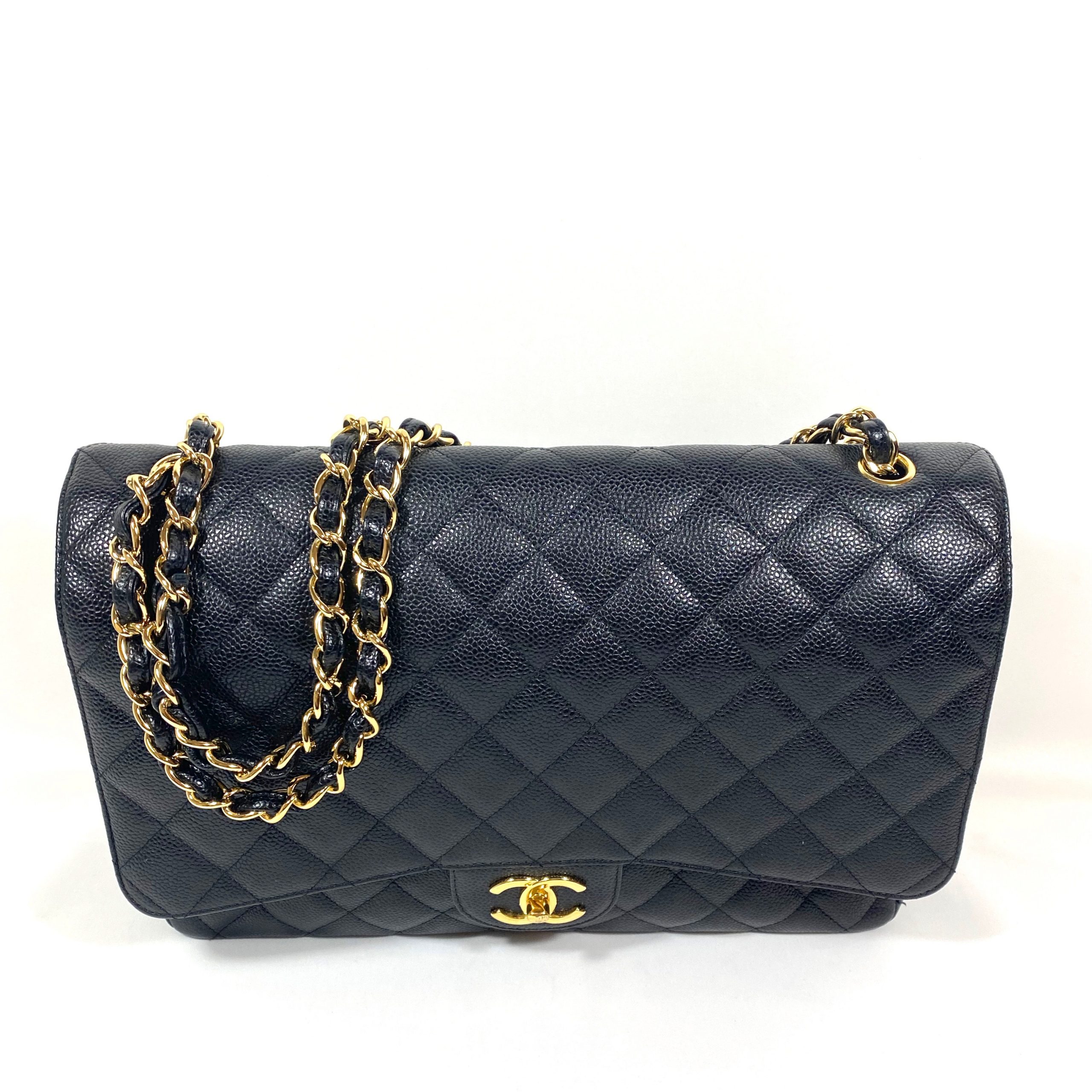 CHANEL MAXI QUILTED DOUBLE FLAP BLACK CAVIAR LEATHER SHOULDER BAG - Still  in fashion